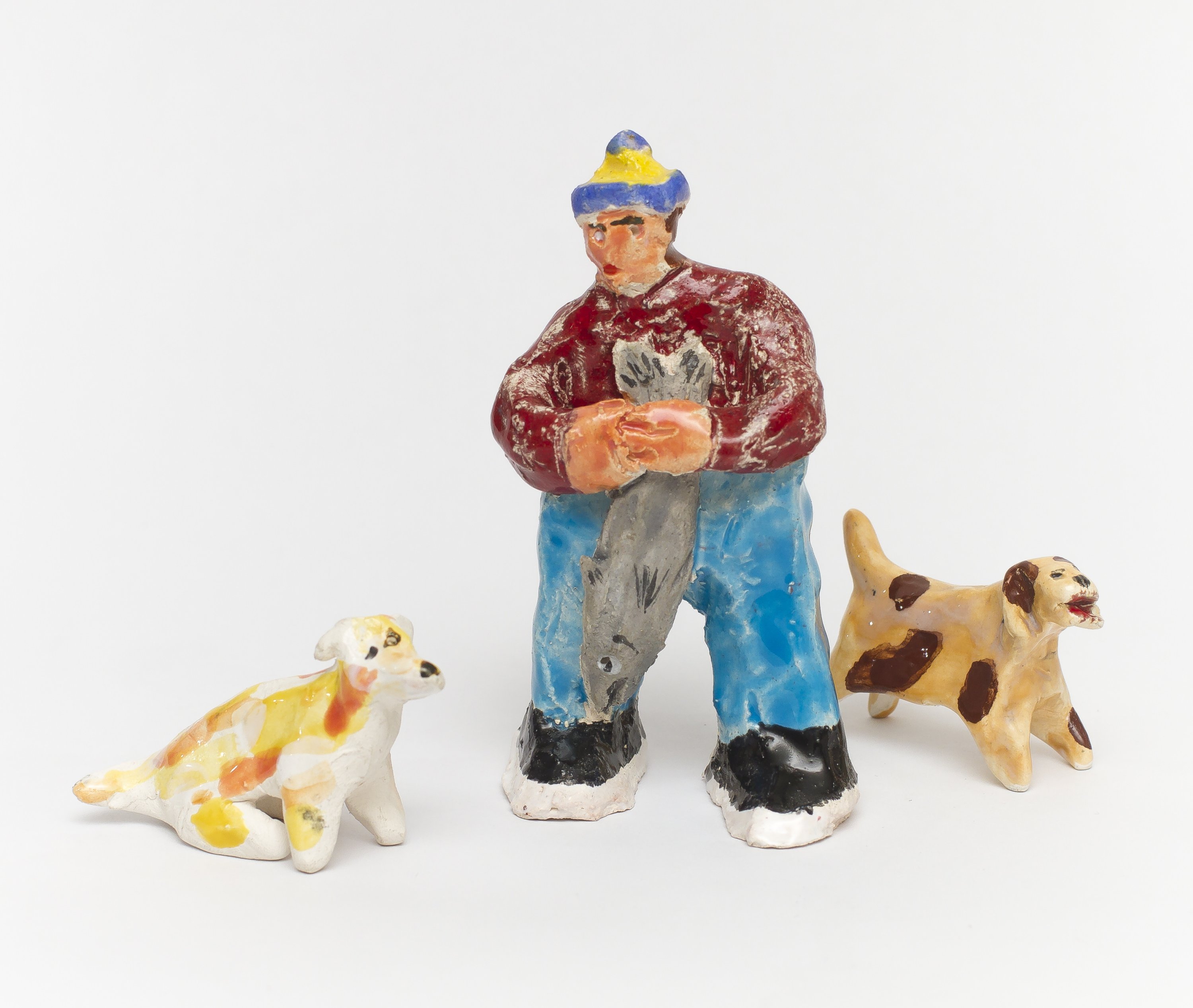 Pescador y perros mirones