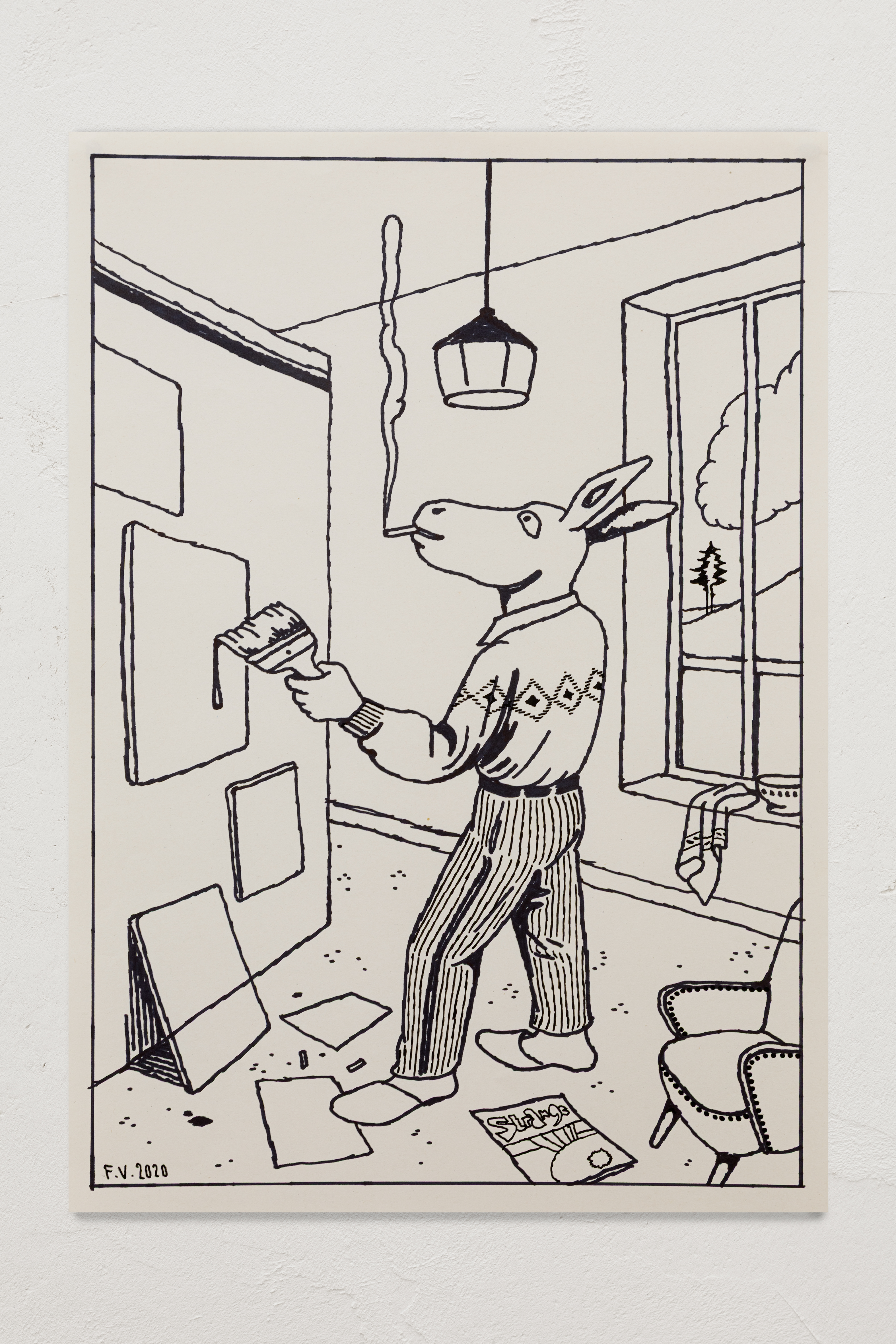 Painter with diamond-patterned sweater in the studio